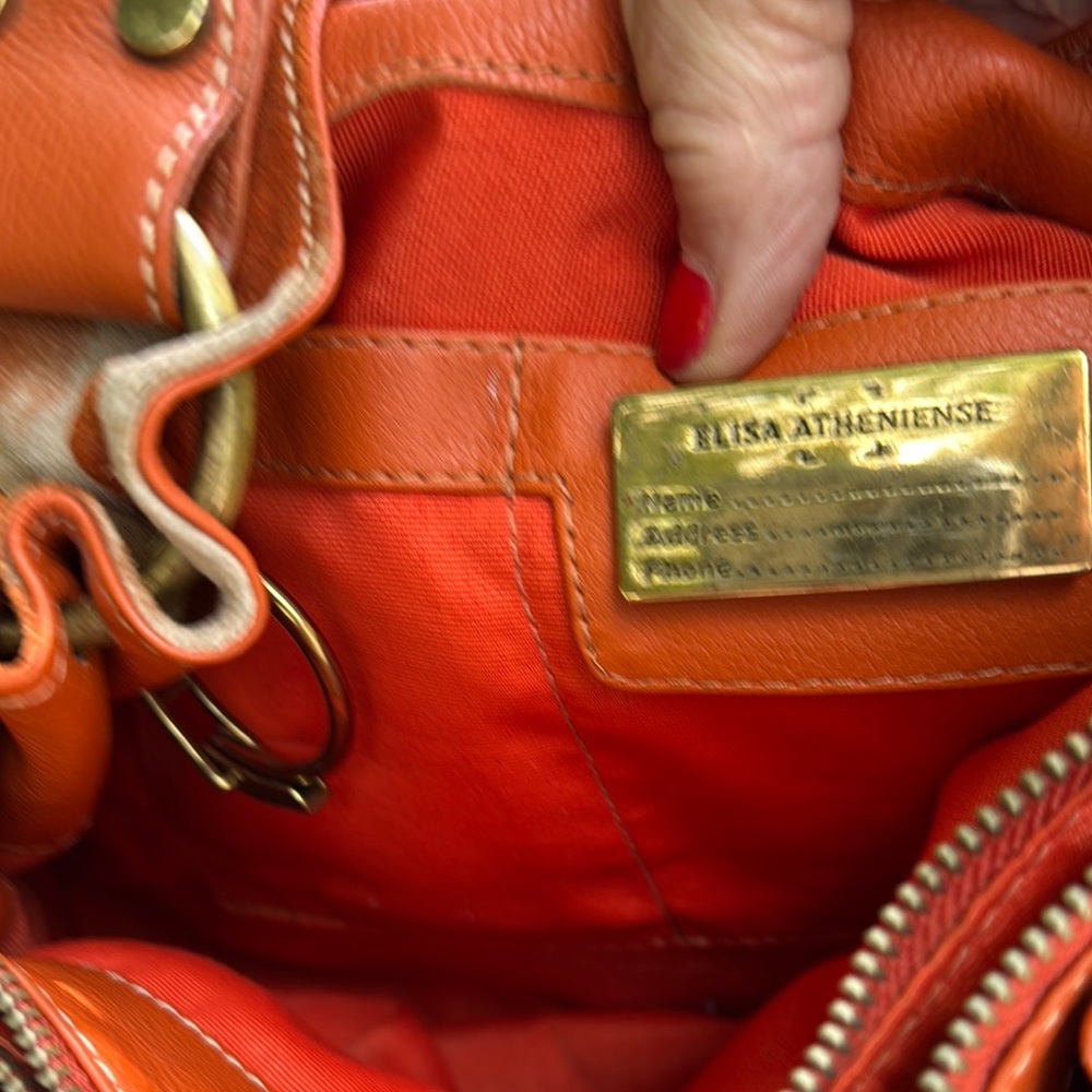 Vibrant Orange Leather Shoulder Bag with Gold Accents